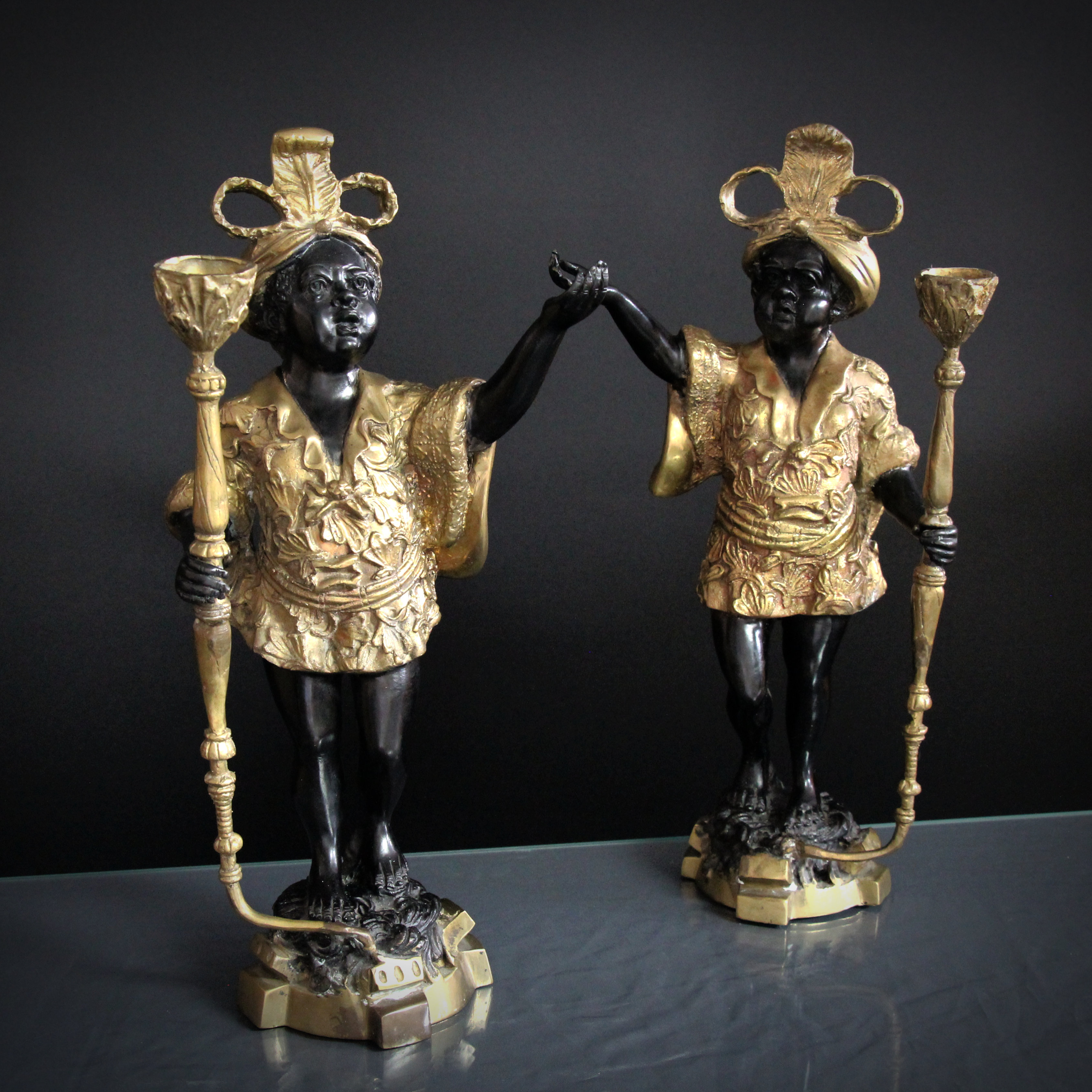 Pair of antique bronze candle holders